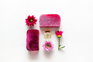 Fototapeta na wymiar natural cosmetics, soap, herbs and flowers on a white background