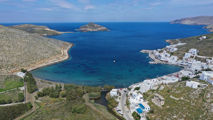 Aerial drone photo of picturesque beautiful fishing village and small harbour of Panormos, Tinos island, Cyclades, Greece