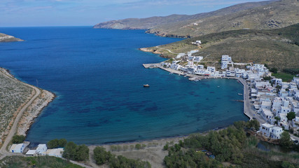 Obraz premium Aerial drone photo of picturesque beautiful fishing village and small harbour of Panormos, Tinos island, Cyclades, Greece