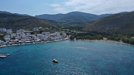 Fototapeta na wymiar Aerial drone photo of picturesque beautiful fishing village and small harbour of Panormos, Tinos island, Cyclades, Greece