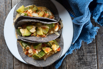 Mexican zucchini stew  tacos with blue tortilla