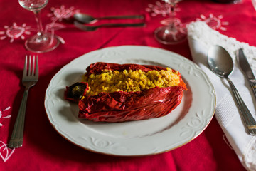 Red pepper stuffed with rice and meat in luxury cutlery