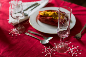 Red pepper stuffed with rice and meat in luxury cutlery