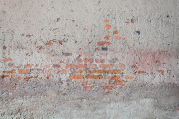 Old Weathered Damaged Concrete Wall With Bricks Visible
