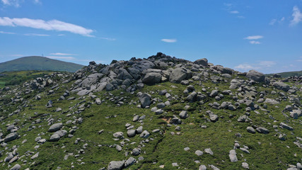 Aerial drone photo of Lunar landscape with big round granite stones a unique geological phenomenon in Volax village, Tinos island, Cyclades, Greece