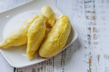 The king of fruit from Thailand, Durian in white dish with wood background.