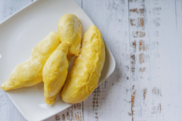 The king of fruit from Thailand, Durian in white dish with wood background.