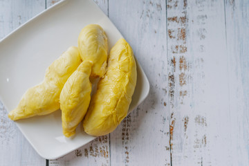 The king of fruit from Thailand, Durian in white dish with wood background.