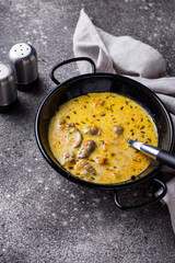 Stewed chicken heart in sour cream