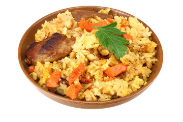 pilaf with meat on brown plate isolated on white background.