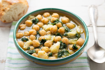 Chickpea soup with spinach and dry cod