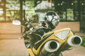 A sporty motorcycle parked in front of a coffee shop
