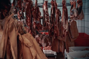 Obraz na płótnie Canvas Production of meat products in the supermarket in the supermarket. Next, distribution of finished products to the store's shop for customers. Sausage, meatloaf, pate ...