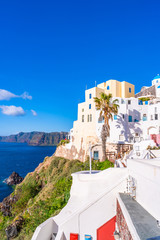 Santorini landscape with traditional whitewashed houses and view of Aegean Sea in Oia, Greece