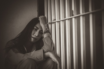 Hands of women desperate to catch the iron prison,prisoner concept,thailand people,Hope to be...