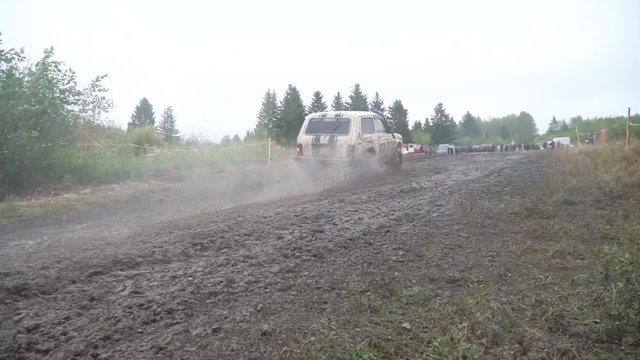Moscow, Russia - September 2018: Russian off-road car Lada Niva 4x4 driving on the field. Clip. Russian off-road racing. Cars take part in annual off-road races
