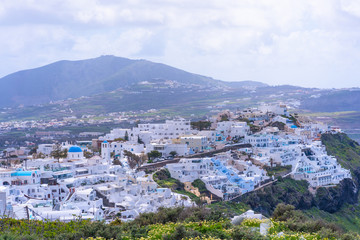 Fototapeta na wymiar View of Fira with whitewashed houses, the capital of Greek island Santorini.