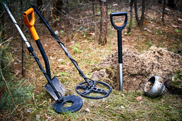 Search for treasure using a metal detector and shovel.
