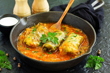 Ukrainian traditional dish with cabbage and stuffed cabbage. Selective focus.
