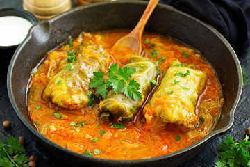 Ukrainian traditional dish with cabbage and stuffed cabbage. Selective focus.