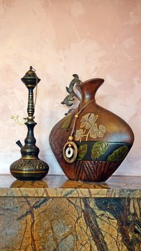 hookan and vase on the fireplace 