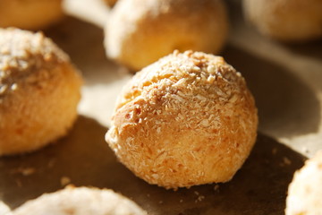 Close-up of a baked bun with side solar lighting. Fresh cottage cheese bread for healthy eating at home recipe