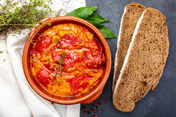 Peppers (del Piquillo) stuffed with meat or fish. Roasted red peppers and fillings made at home. Recipe of Spanish food and Mediterranean diet. With delicious sauce to spread bread.