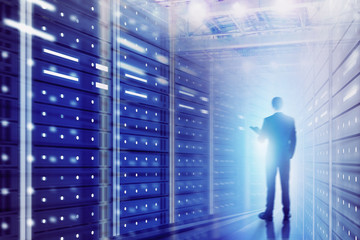 Man with folder in data center