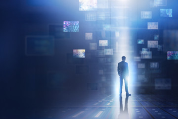 Man using abstract virtual information interface
