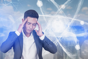 Stressed Asian scientist, atom hologram