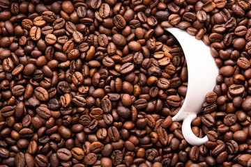 white cup of coffee beans top view