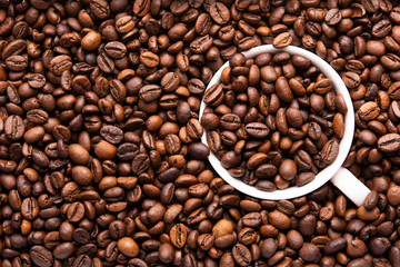 white cup of coffee beans top view