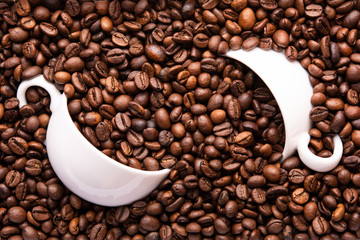 two white cup of coffee beans top view
