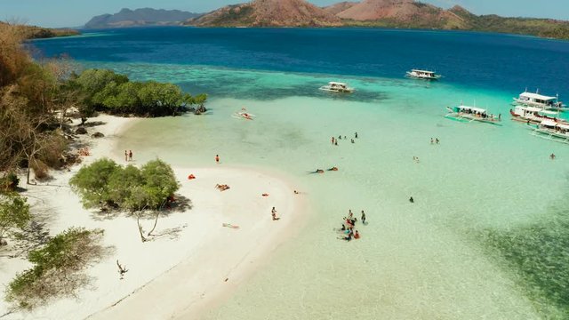 aerial view tropical island with sand white beach, clear and blue water. CYC Beach, Philippines, Palawan. Tropical landscape with blue lagoon, coral reef. travel concept