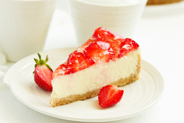 Classic cheesecake with fresh strawberries. Selective focus.