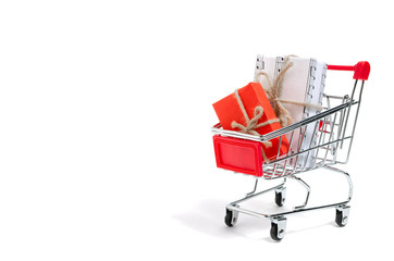 Shopping cart filled with gifts on white background.