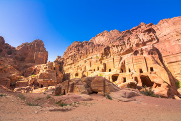 Caves in sandstones, columns and ruins of the ancient Bedouin city of Petra, Jordan