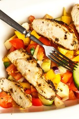 Chicken meat with vegetables. Chilli peppers marinade. Grilled food. Protein diet. Food for athletes.