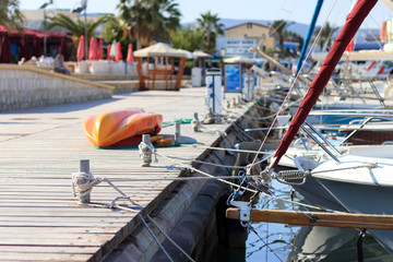 Yachts and boats tied to e berth at marina