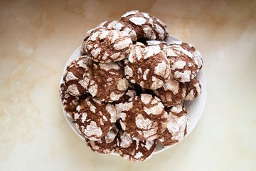 Sweet cocoa chocolate crinkle cookies served on a plate