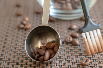 coffee beans in a scoop