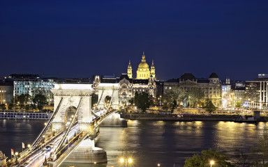 Fototapeta na wymiar Chain Bridge leading to Pest side with Basilika in the distance in Budapest.