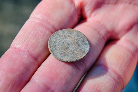 Antique Soviet coin covered with a patina worth 3 kopecks on the palm.