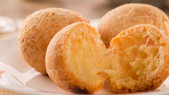 Slide shot Cheese bread. Traditional brazilian food with smoke.