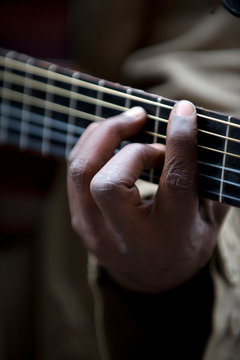 image of a person playing the guitar