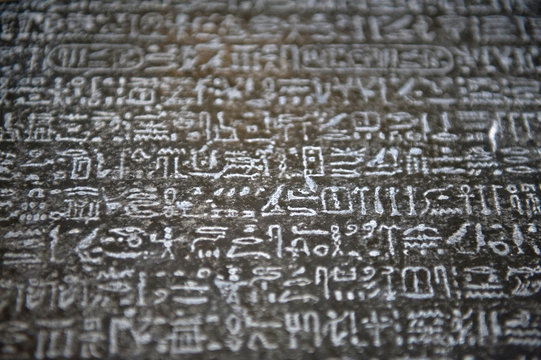image of a wall with hieroglyphs, rosetta stone