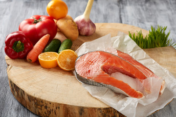 products on a wooden background in a paper bag fish steak