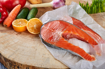 products on a wooden background in a paper bag fish steak