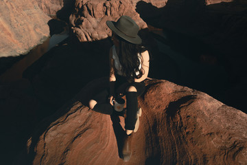woman sitting on mountain top