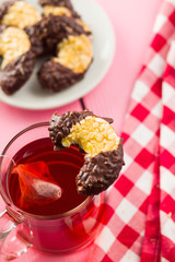 Sweet biscuits dessert and red fruity tea.